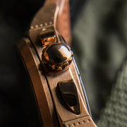 A 42mm case is inspired by the Spitfire's famous curved silhouette, with custom flowing pushers designed to complement this feature. Taking further inspiration from the Spitfire's body, micro detailing on the case sides are designed to recreate the panels on the aircraft.