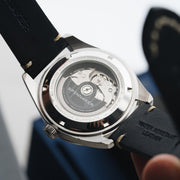An exhibition window case back gives you a view of the movement and winding rotor of the Seiko TMI NH35 in the Spinnaker Fleuss.