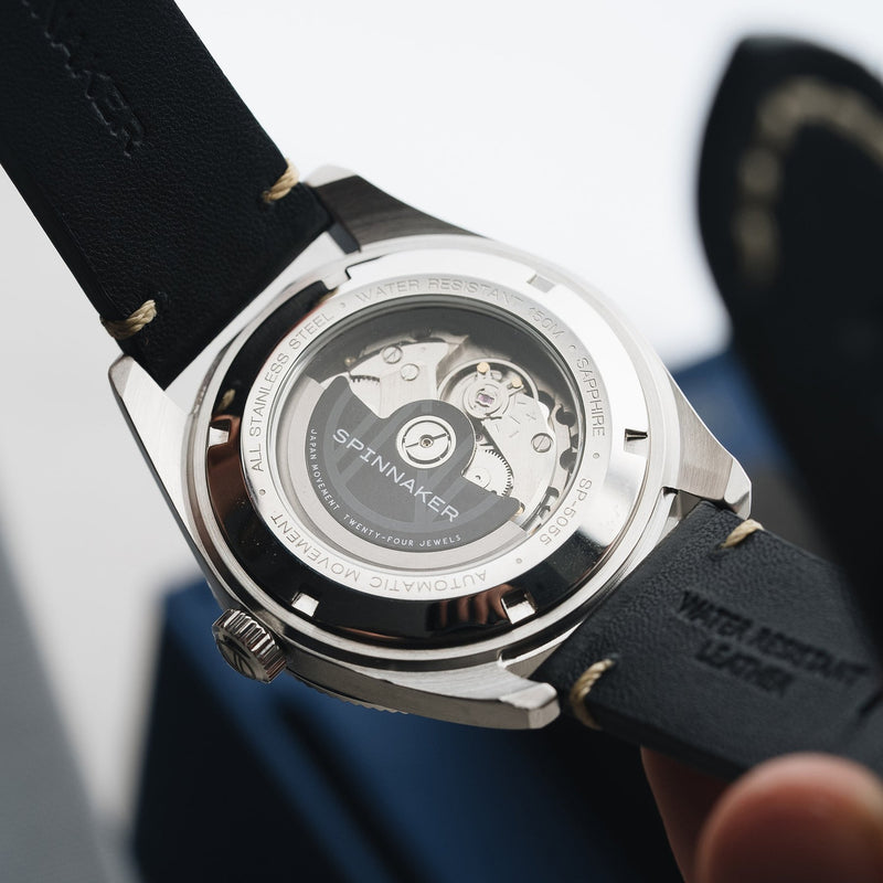 An exhibition window case back gives you a view of the movement and winding rotor of the Seiko TMI NH35 in the Spinnaker Fleuss.