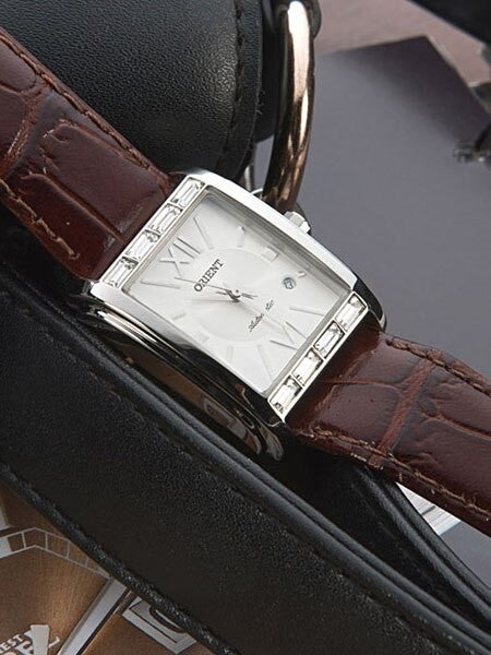 Orient Romance Women's Automatic Dress Watch with Curved Crystal and CZ Baguettes on the Bezel #ENRAP002W