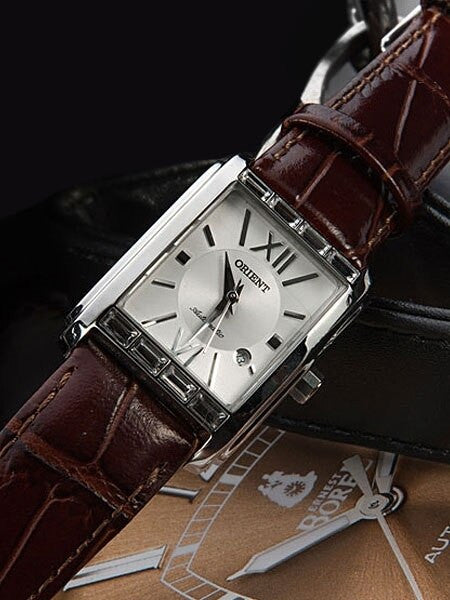 Orient Romance Women's Automatic Dress Watch with Curved Crystal and CZ Baguettes on the Bezel #ENRAP002W